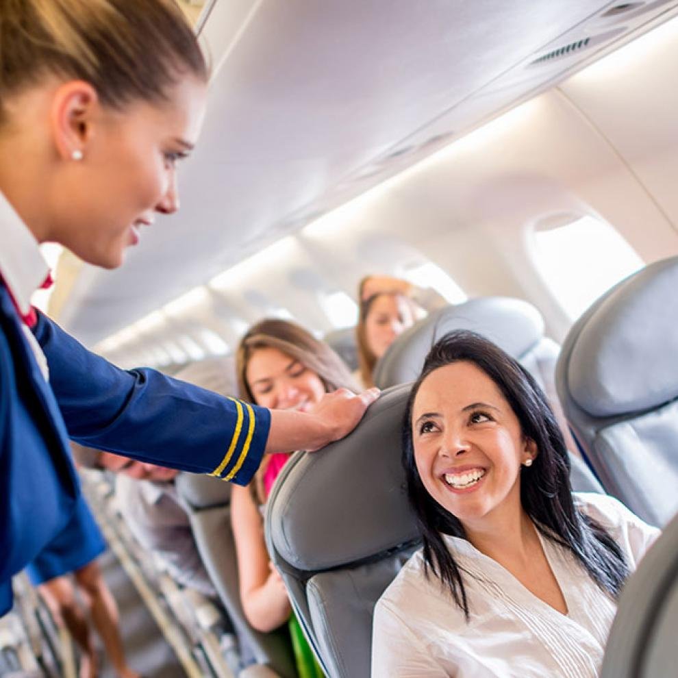 Flight attendant speaking with the passenger
